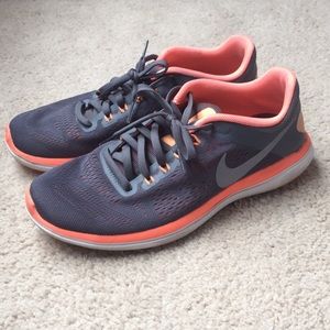 Gray and pink Nike tennis shoes